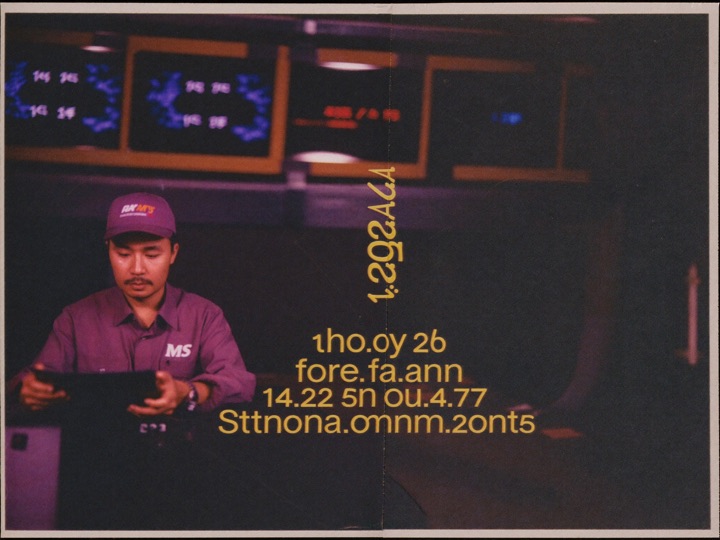 A broadcast studio control room, an operator at a desk of monitors